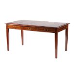 An Edwardian inlaid mahogany library writing table with an inset leather top fitted three frieze