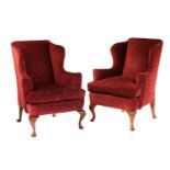 A pair of mahogany framed wingback armchairs, with modern deep red upholstery on front cabriole