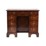 A George I/II style walnut lady's kneehole writing desk with cross and herringbone banded top