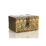 An Indo Persian style rectangular brass and steel box overlaid with intricately fretted Islamic