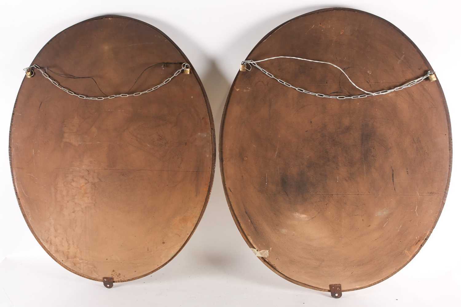 A pair of George III Adam style gilt framed oval mirrors, 20th century, with moulded paterae between - Image 5 of 5