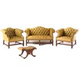 A George III style hide upholstered two-seater 'camelback' settee and a pair of matching