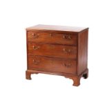 A George III mahogany provincial commode chest of three long drawers, with swan neck handles and