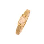 A lady's Omega wristwatch, in 18ct yellow gold, the rectangular champagne dial with baton markers,