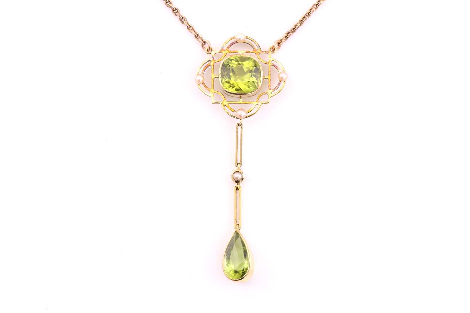 A peridot pendant necklace, early 20th century, the pendant centred by a cushion shape peridot,