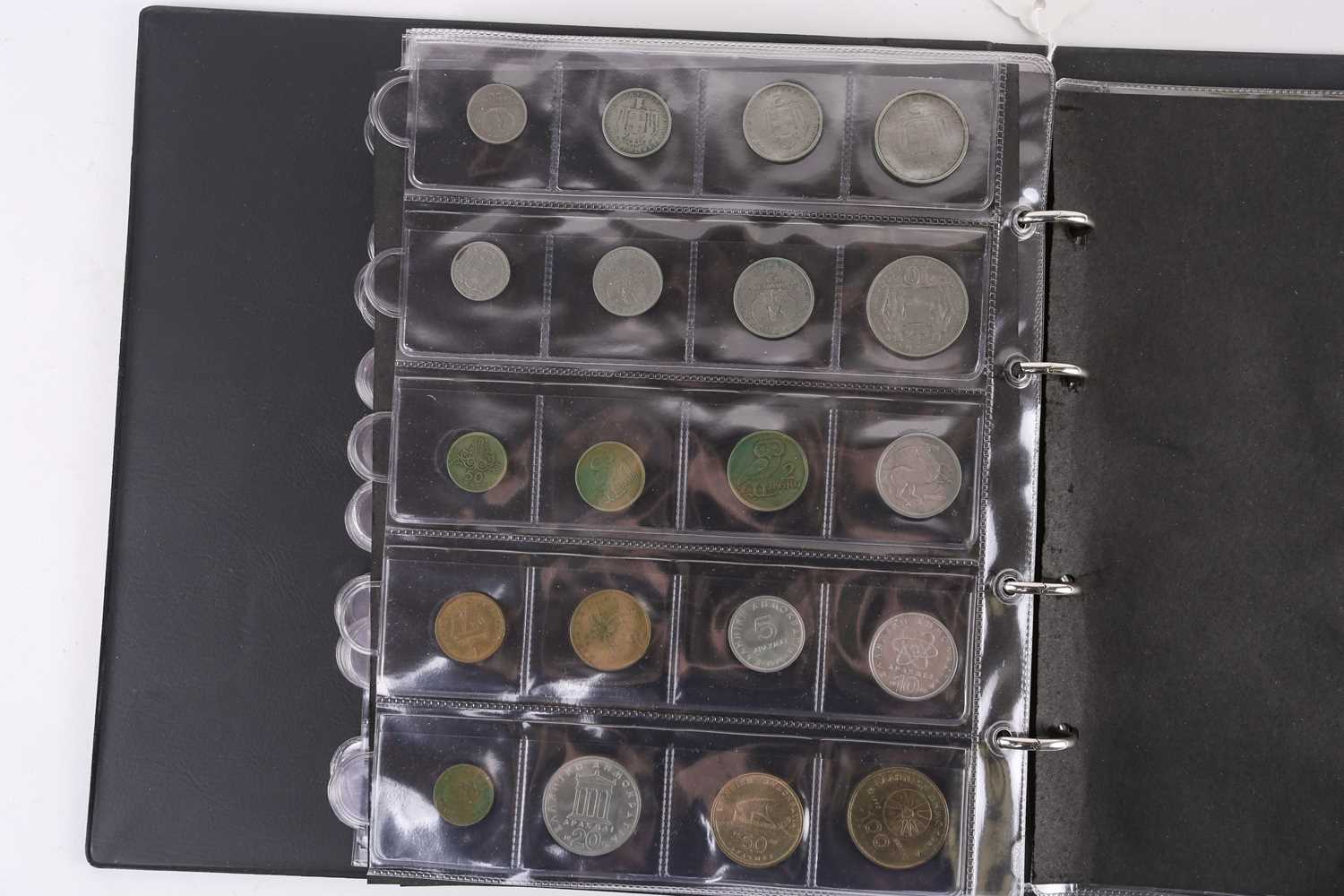 A lot consisting of a collection book of coins from all around the world including The United - Image 23 of 28