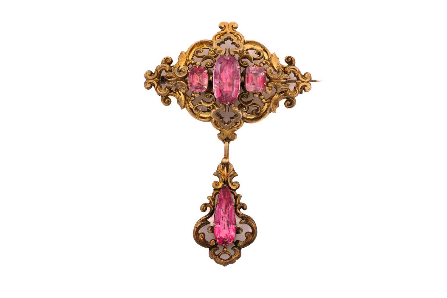 An early to mid 19th century topaz brooch; the central lozenge -shaped panel of open scrolling