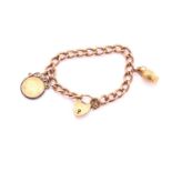 A 9ct rose gold charm bracelet with heart shape padlock and a two handled urn, stamped 750, and a