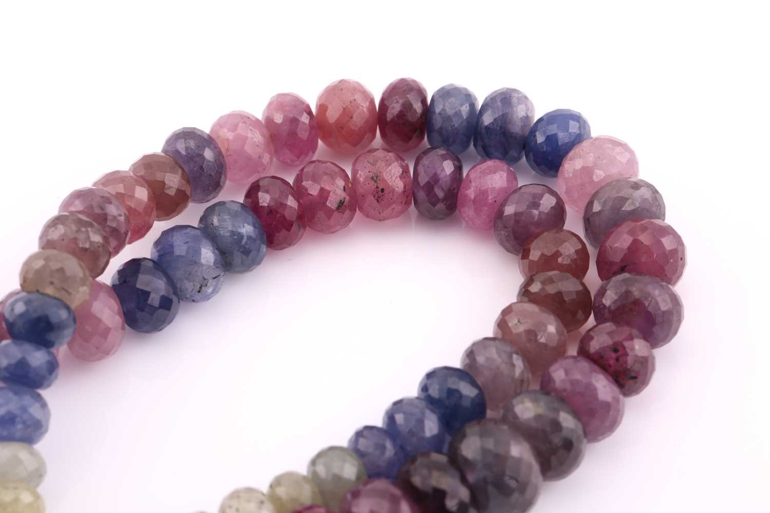 A sapphire and ruby faceted bead necklace, the yellow, blue, pink and red graduated beads 14mm - Image 2 of 6