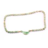 Single row jade bead necklace, with yellow metal reeded spacer beads, gilt metal clasp, and