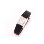 A silver Cartier Tank ladies wristwatch with a Swiss-made quartz movement, a case measuring 23.5 x