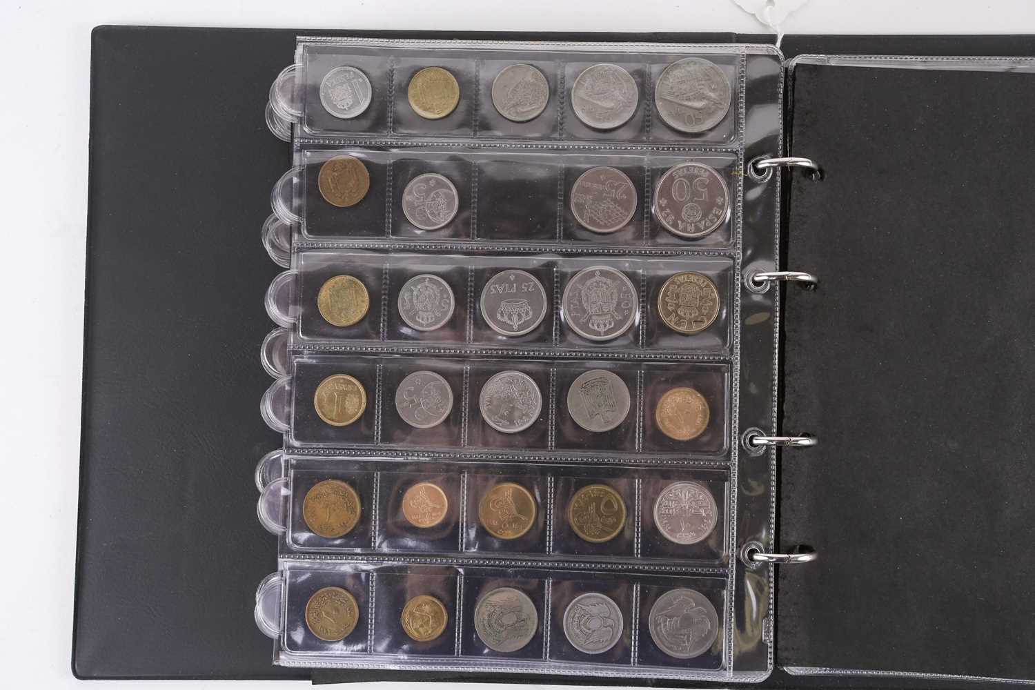 A lot consisting of a collection book of coins from all around the world including The United - Image 20 of 28