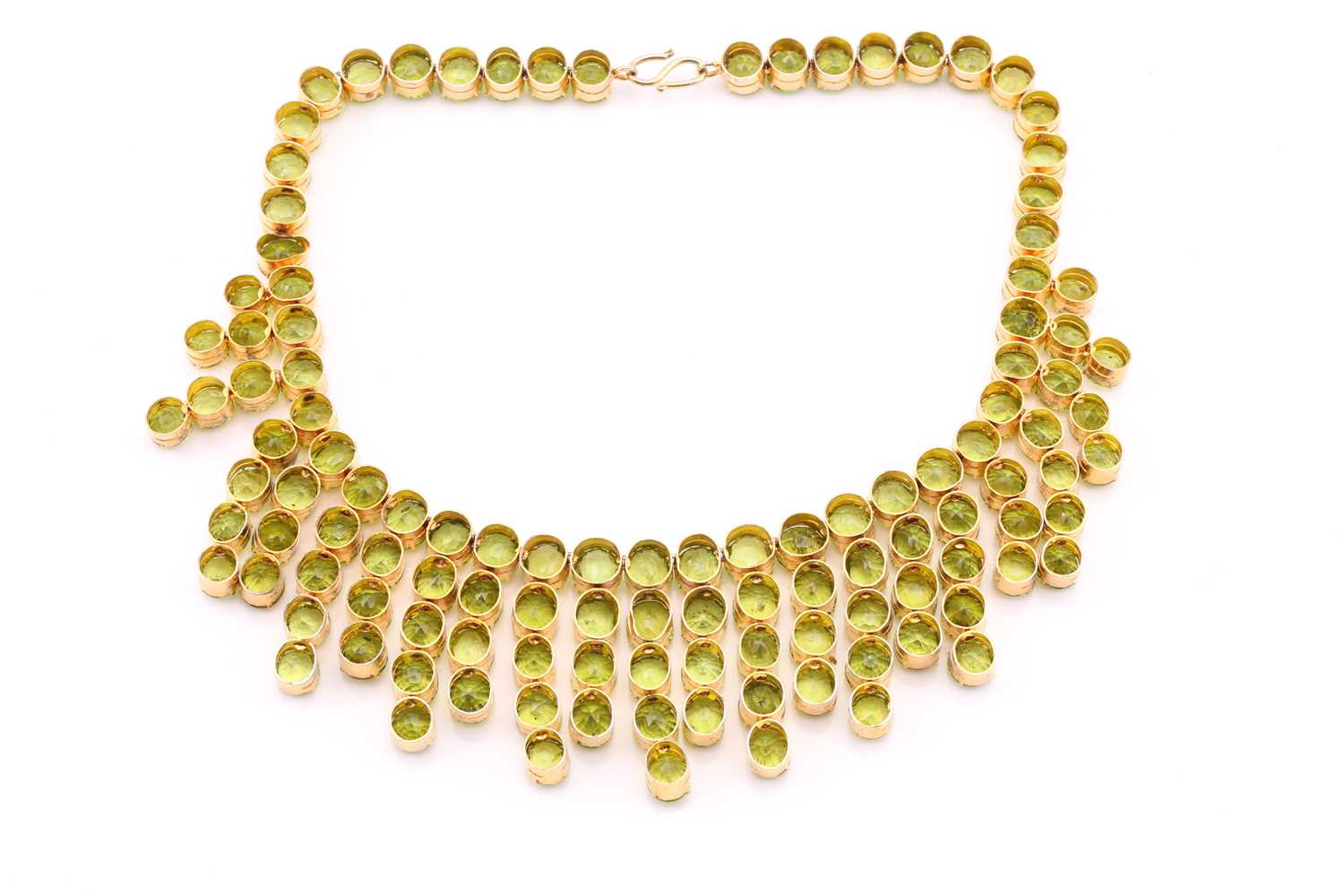 A peridot fringe necklace, oval and round cuts claw set to gilt metal mount, peridots averaging 8. - Image 4 of 6