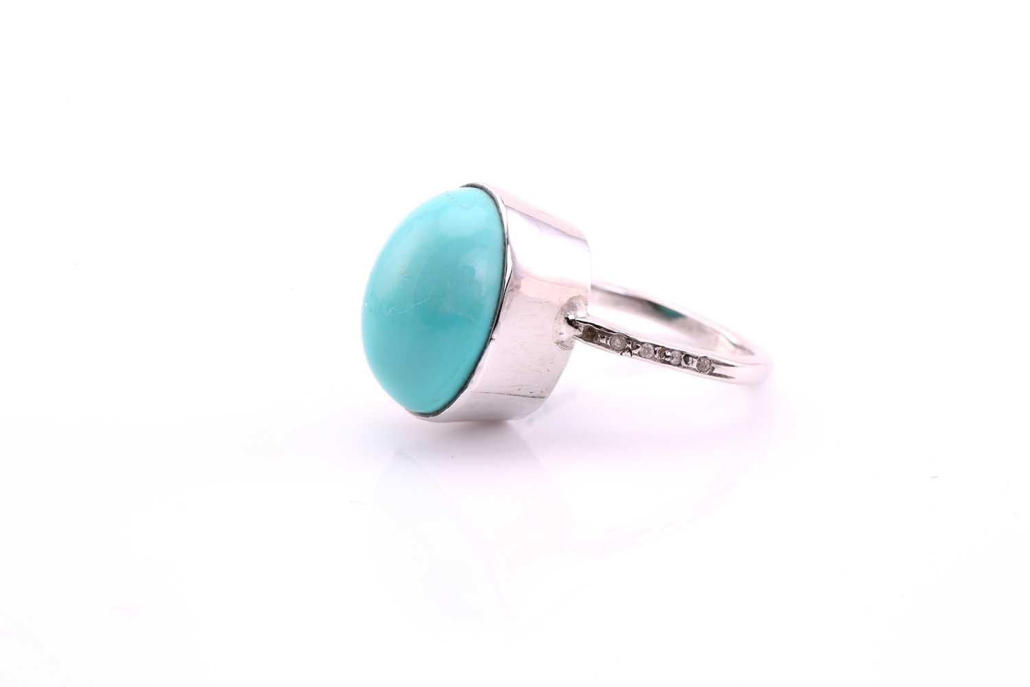 A turquoise and diamond ring, the oval cabochon turquoise, 17.4mm by 13.6mm set in white metal - Image 3 of 4