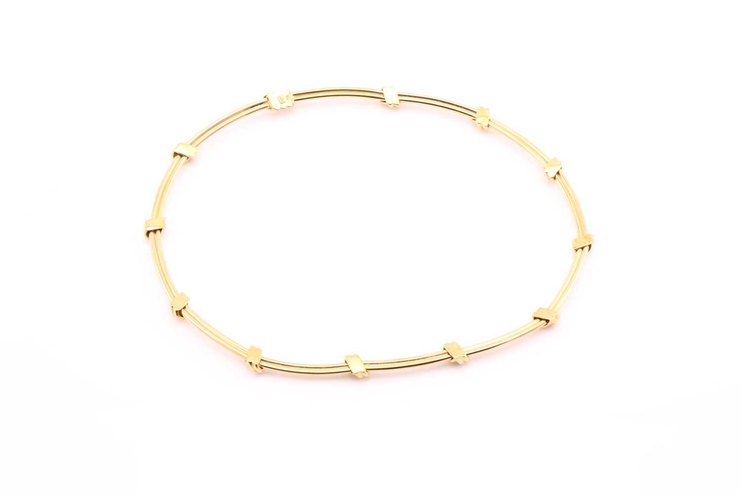 A Mappin and Webb 18ct yellow gold articulated necklace consisting of twelve sections in a rope