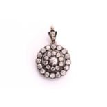 A Victorian old cut diamond target pendant, consisting of mixed round old cuts with a total