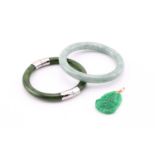 A jade bangle; together with a hinged jade bangle and a carved Bhudda pendant .(3)