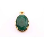 A large oval emerald set pendant, consisting of a 43.55ct oval cut emerald, claw set into a double-