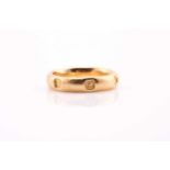 An 18ct gold wedding band with full Millenium hallmarks to the exterior band, ring size M, 6grams,