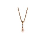 A pearl and diamond drop necklace consisting of a stamped 750 gold rope chain measuring 42cm in