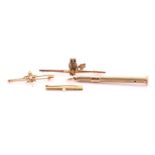 Three bar brooches and a 9ct gold propelling toothpick, the maple leaf bar brooch set with seed