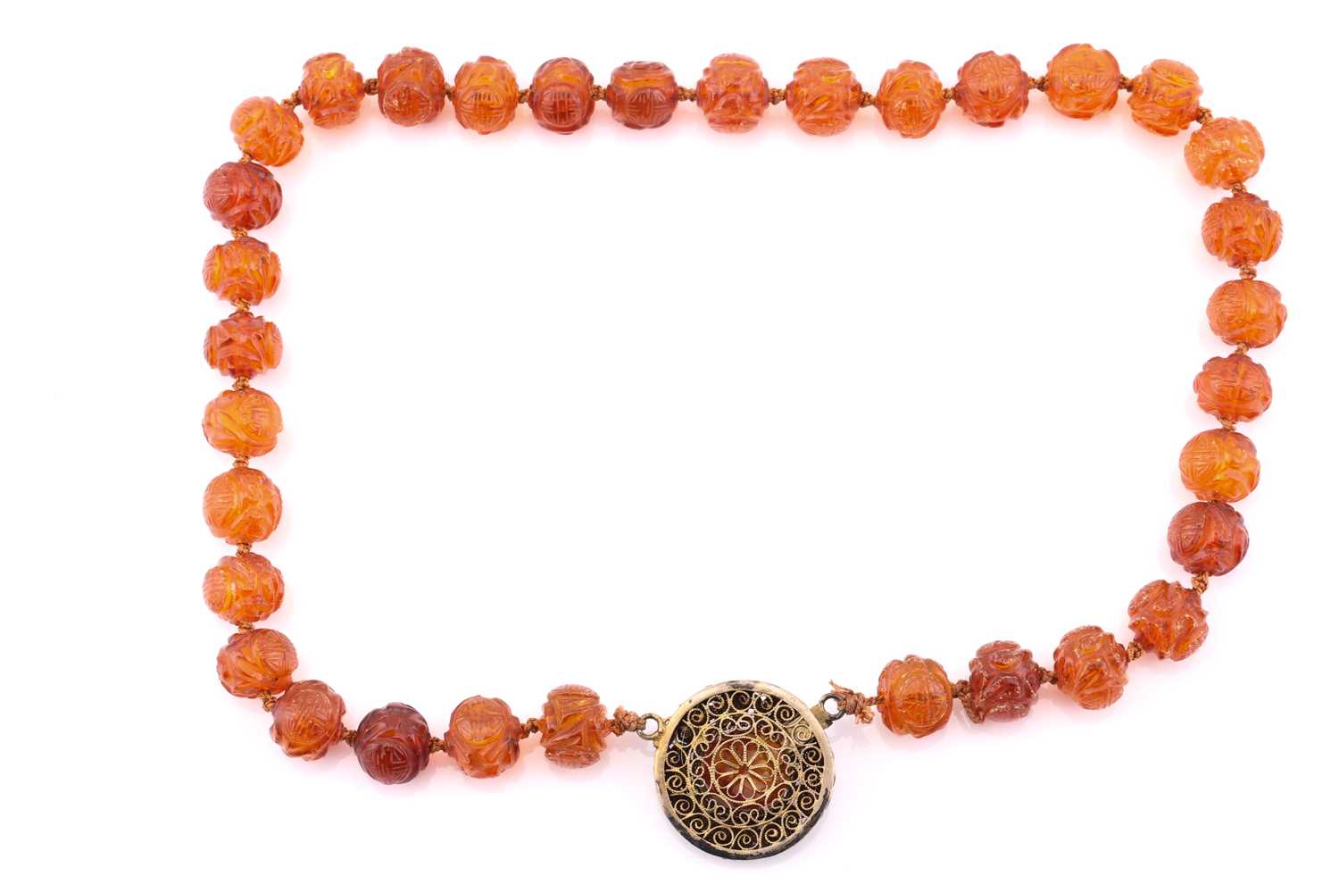 A single row carved amber bead necklace, each carved with 'Shou' medallions and foliage, gilt - Image 2 of 2