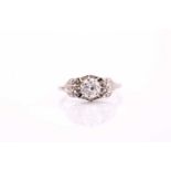 A single stone diamond ring, the round brilliant cut high claw set to a white precious metal