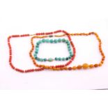 Red coral bead necklace, oval beads from 7.5-9mm wide, '375' stamped barrel clasp, 74cms long; a