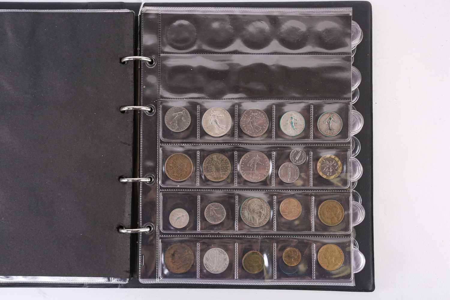 A lot consisting of a collection book of coins from all around the world including The United - Image 10 of 28