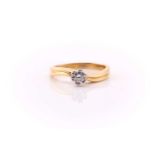 A single stone diamond ring; the round brilliant cut diamond in six double claw mount to a shaped