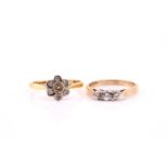 A diamond cluster ring, the seven stone cluster in bi-coloured, 18 carat gold mount, Size N, 2.6g;