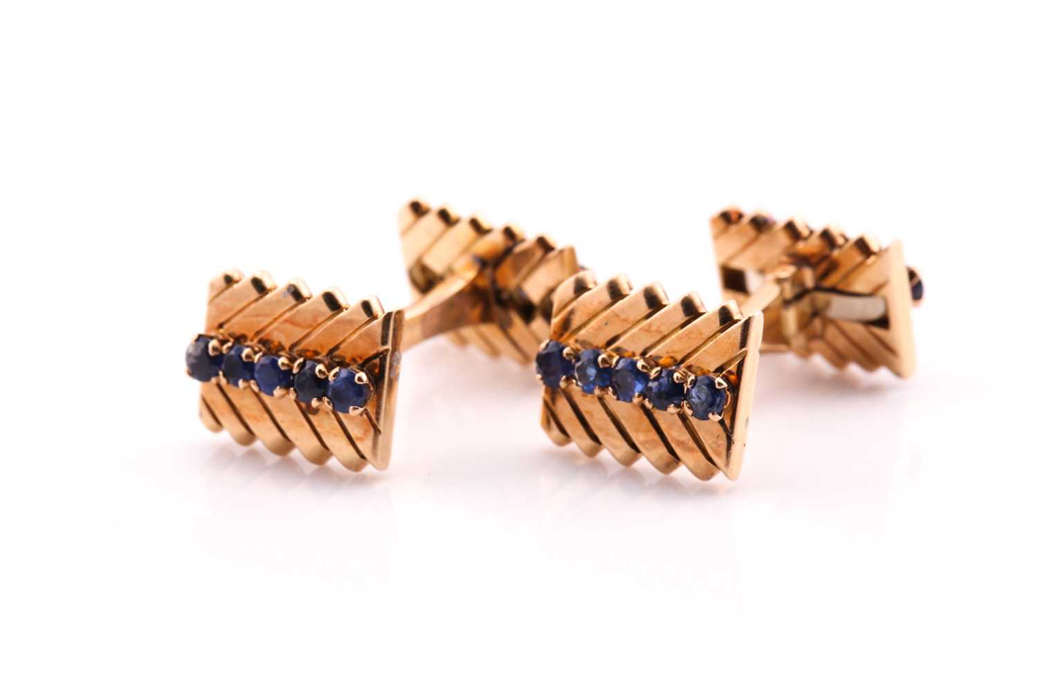 A pair of sapphire set dress cufflinks, featuring twenty round claw set cufflinks on T-bar rigid