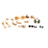 A collection of twelve pairs of stud earrings and a pair of drop earrings, comprising of a pair of