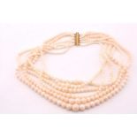 A six row white coral bead neckalce, the white and pale pink beads graduated from 4 to 14mm