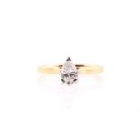 A single stone diamond ring; the pear-shaped diamond in three claw mount to plain 18 carat gold