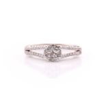 A diamond cluster ring; the central circular cluster set with round brilliant cut diamonds, to