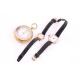 A lot consisting of a pocket barometer a trench watch and a lady's wristwatch. The pocket