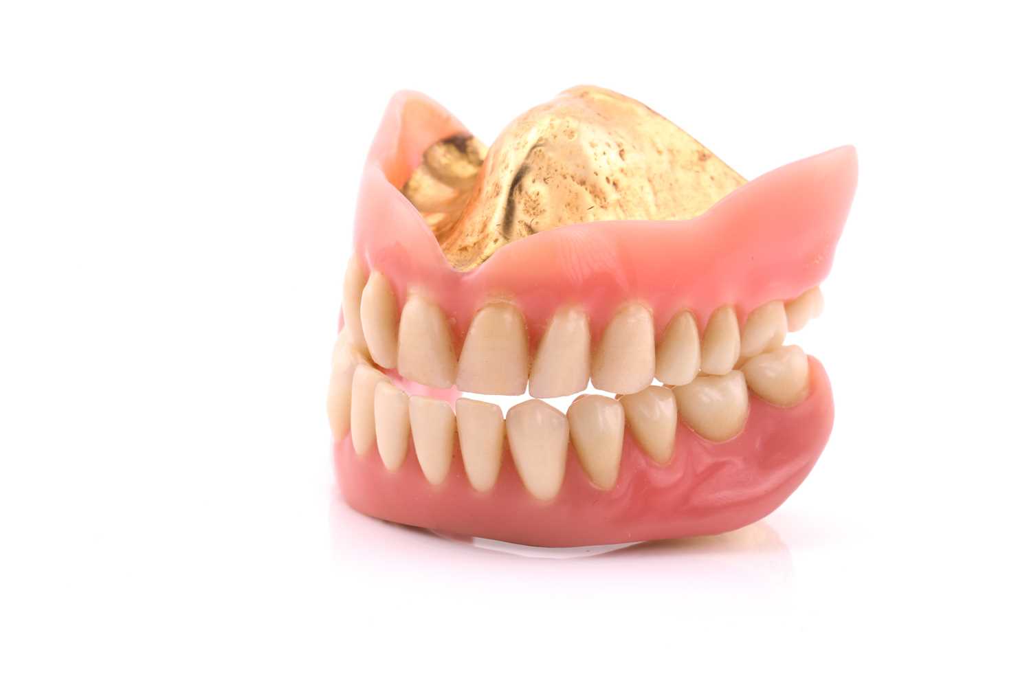 Pair of false teeth with gold content, 53.8 grams all inCondition report: Tested as 18k gold plus