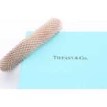 A Tiffany and Co sterling silver mesh bracelet, measuring an internal diameter of 19cm, 15-16mm wide