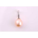 A drop pearl pendant with diamond set-top loop, consisting of a pinkish/white cultured pearl