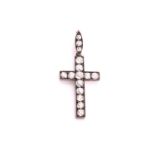 A Victorian old cut diamond set cross pendant, consisting of fifteen old cut diamonds with an