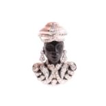 A 'Mooretto' brooch, modelled as a bust of a figure dressed as a moor, his turban, earrings and