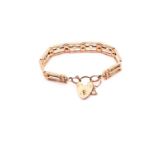 A 9ct rose gold gate bracelet with padlock, consisting of nine articulated sections measuring 11.4mm