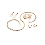 A 9ct gold necklace, two pairs of textured yellow metal earrings and a German brooch, marked 333,