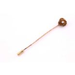 An old cut diamond set stick pin, consisting of a round old cut with an approximate weight of 0.06ct