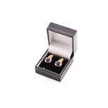 A pair of Bvlgari 18 carat amethyst and diamond earrings, the oval cabochon amethyst set in yellow