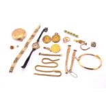 A collection of broken gold and yellow metal items, including a 9ct yellow gold compact, 14.9 grams,