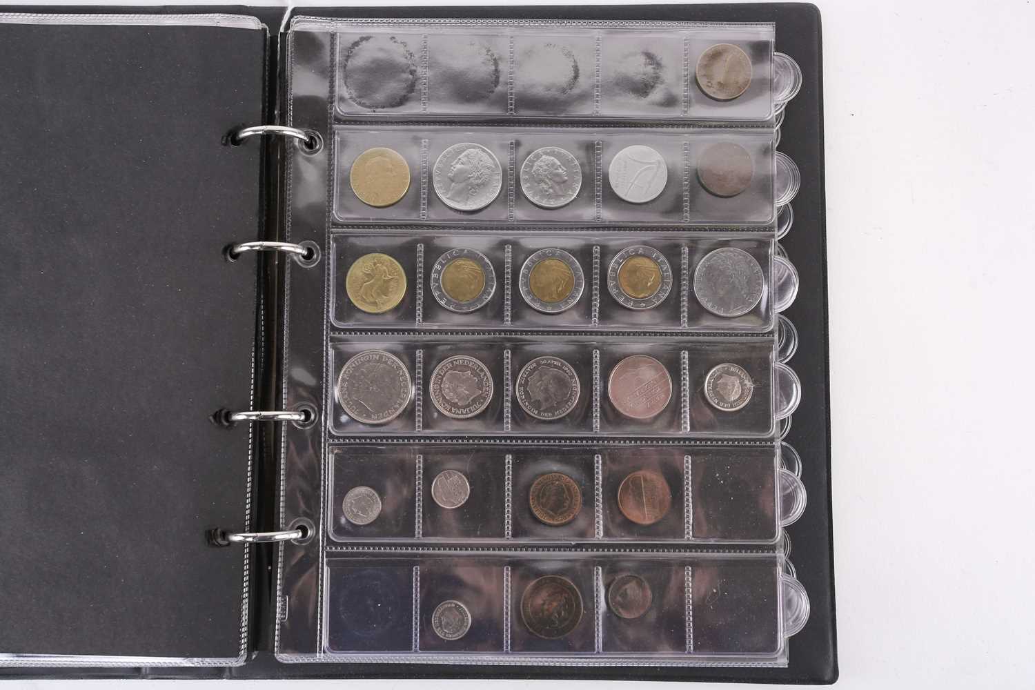 A lot consisting of a collection book of coins from all around the world including The United - Image 18 of 28