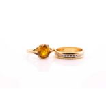 A lot consisting of a single stone ring and wedding band, the single stone ring comprises from an