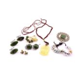 A mixed lot of jade set items including one necklace on string, two sets of earrings, one